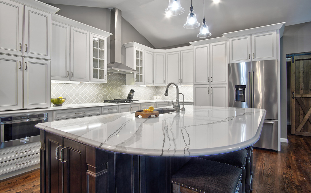 View of kitchen with large island and radius quartz countertop