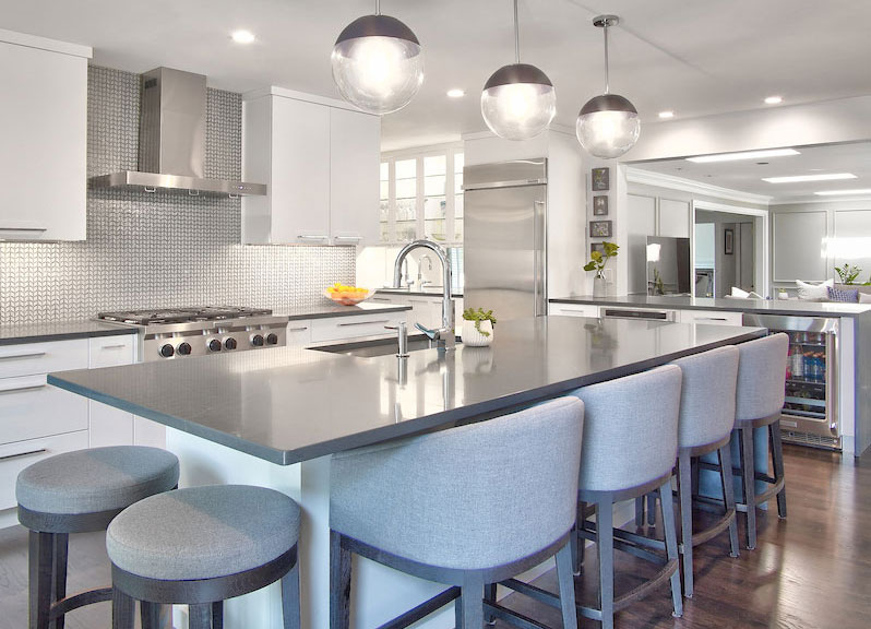 Modern kitchen remodel with white frameless cabinets and large island
