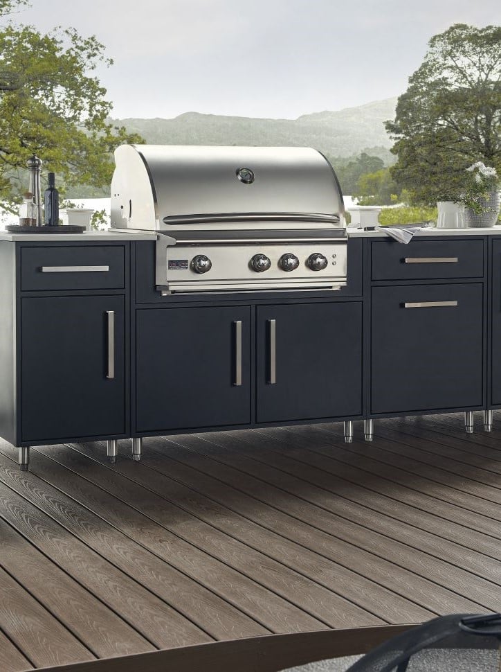 Outdoor kitchen cabinets in flat black door style sitting on deck with lake or water in the background