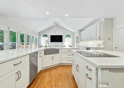 Large St Louis, MO kitchen remodel with two islands and workstation farm style sink.