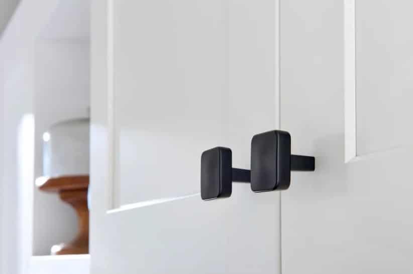 Cabinet knobs in St Louis with black square knobs mounted to white shaker cabinets