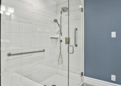 Thompson Price bathroom shower remodel in Chesterfield, MO with stone look porcelain tile.