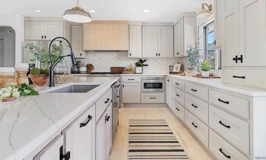 Kitchen with custom white cabinets in standard overlay