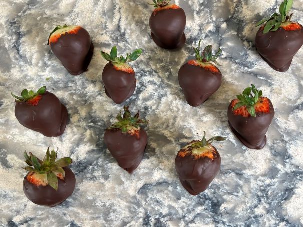 Chocolate covered strawberries laid out in the Thompson Price Kitchen and Bath Design Center