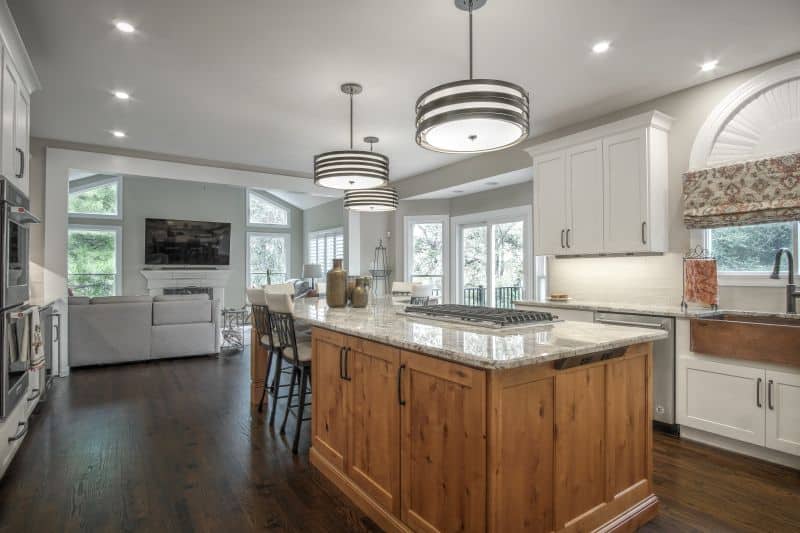 View showing full island with cook-top in kitchen remodel West St Louis County completed by Thompson Price