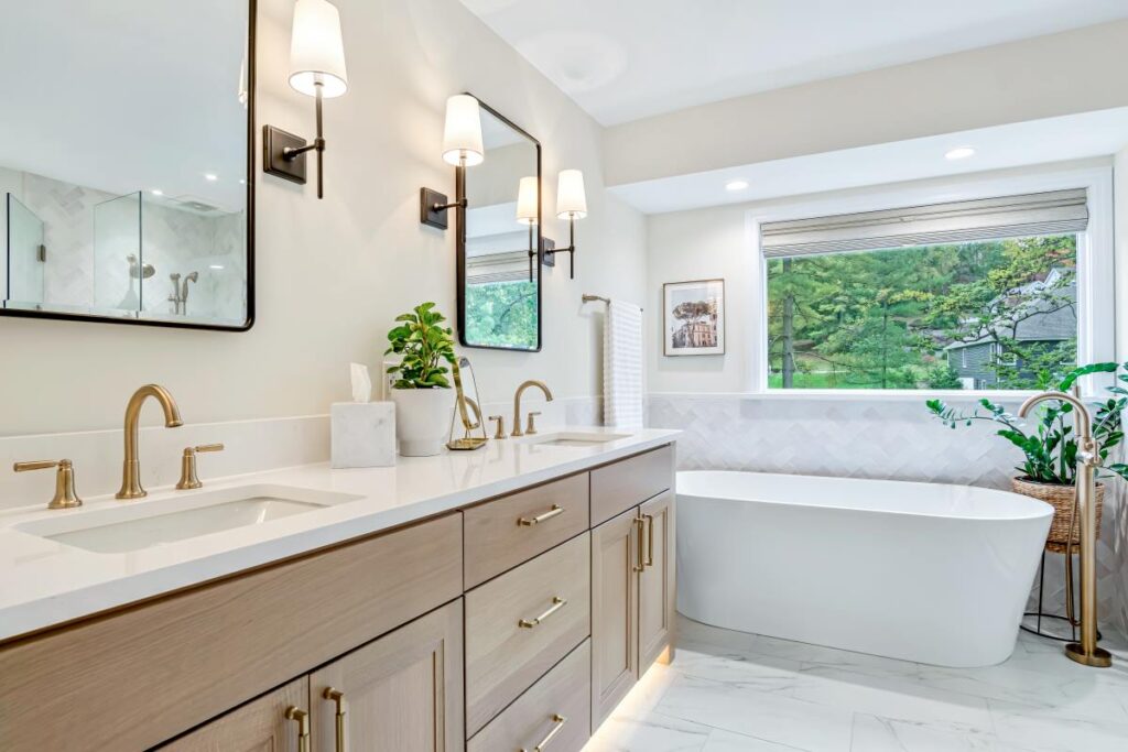 popular design trends for 2025 include biophilic design as shown in this master bathroom remodel with natural stained custom vanity cabinets