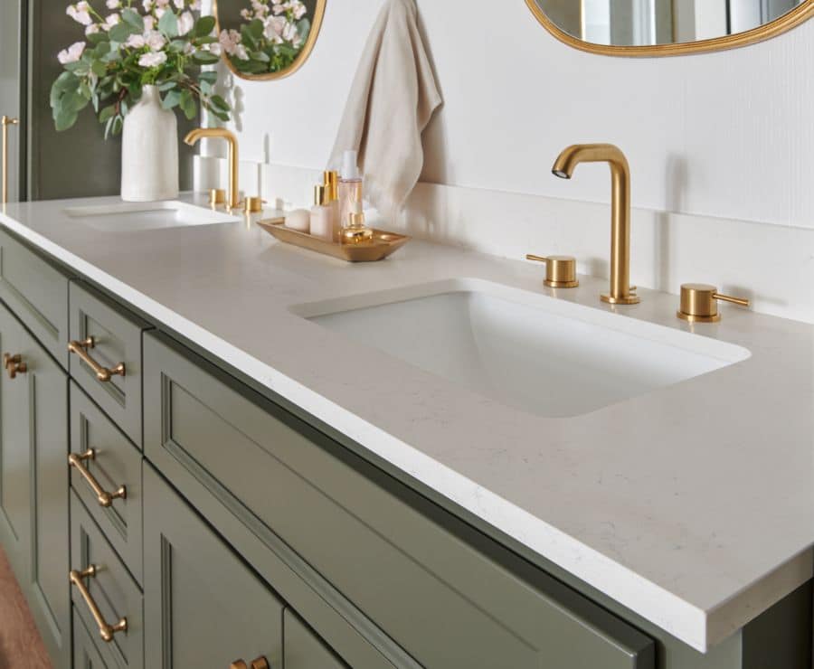 quartz bathroom vanity countertop with double sinks in brushed brass finish